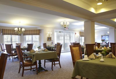 Dining room with tables set for residents