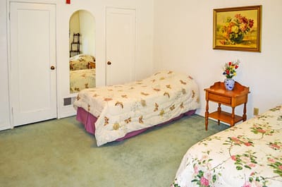 A cozy resident room with floral decor