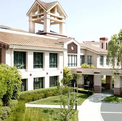 Exterior view of Health Care Center at The Forum, showcasing the building and landscape.
