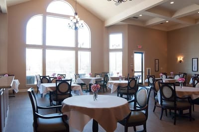 Elegant dining area with tables and flowers