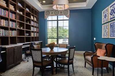 Common area with bookshelves and seating