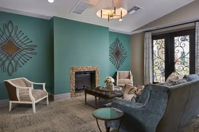 Cozy common area with seating and a fireplace