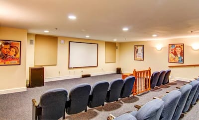 A cozy indoor movie theater with seating