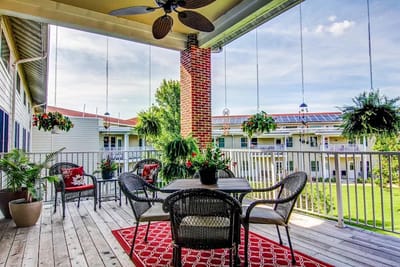 Outdoor seating area with plants and decor