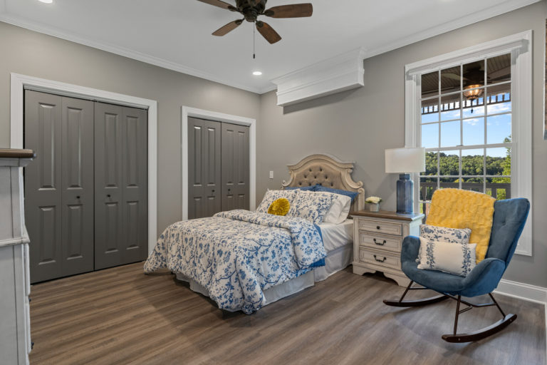 A cozy bedroom with a blue and white theme