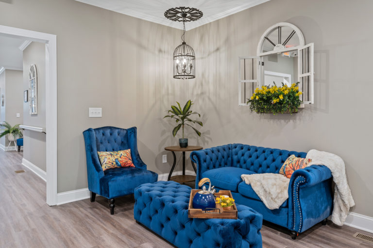 Cozy lounge area with blue furniture and decorative accents