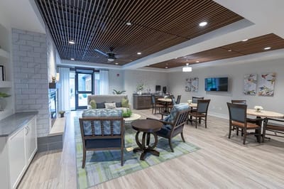 Bright common area with seating and tables