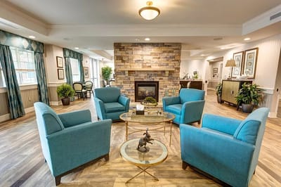 Cozy interior of a common area with chairs and fireplace
