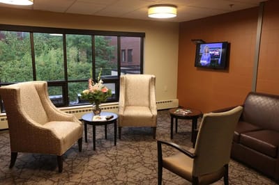 Interior seating area with comfortable chairs and a television