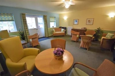 Bright common area with seating and table
