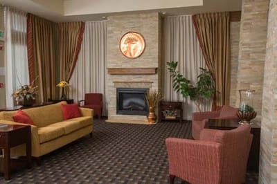 Cozy lounge area with seating and fireplace