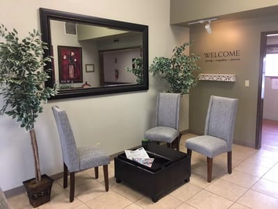 Interior seating area with welcome sign and decor
