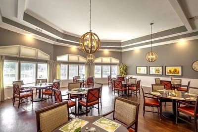 Elegant dining room setup with round tables and chairs