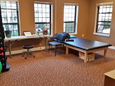 Interior room with therapy equipment and seating