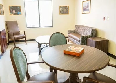 Bright common area with seating and a table