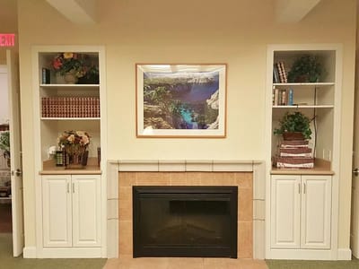 Cozy interior space with decorative shelving and fireplace