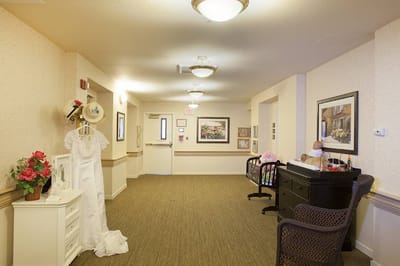 Bright hallway with decorations and a dress display