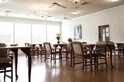 Interior view of a dining area with tables and chairs
