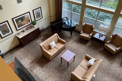 Common area with seating and a grand piano
