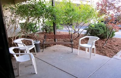 Outdoor seating area with benches and chairs