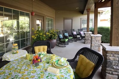 Outdoor patio space with flowers and seating