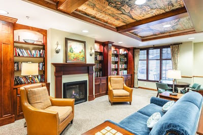 Cozy common area with bookshelves and seating