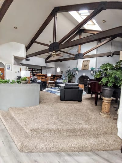 Interior view of a common area with plants and seating