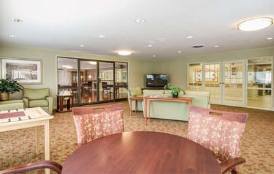 Bright communal area with seating and tables
