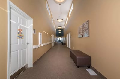 Well-lit interior hallway of a facility