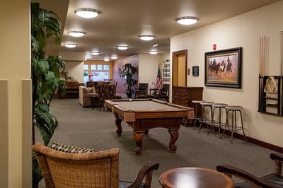 Common area with a billiard table and seating