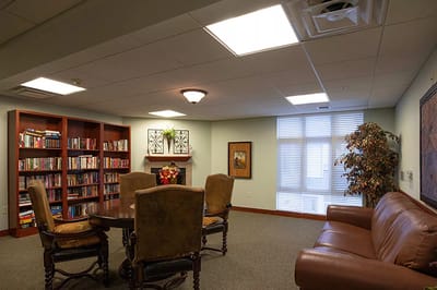 Interior view of a cozy common area with bookshelves