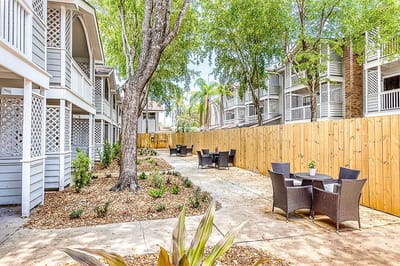 Outdoor space with seating areas and trees
