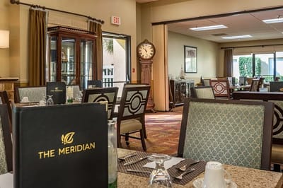 Dining area with elegant seating and decor
