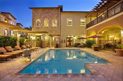 Outdoor pool area with lounge furniture