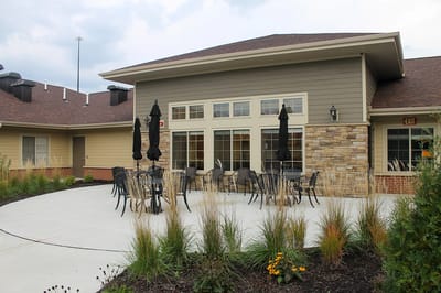 Outdoor seating area with tables and umbrellas