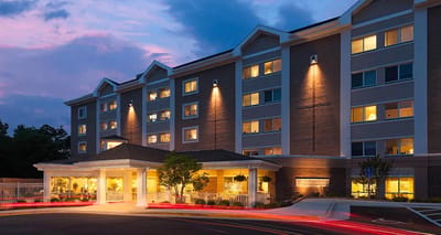 Exterior of Tall Oaks Assisted Living at dusk