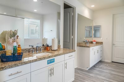 Brightly lit bathroom with modern fixtures and decor