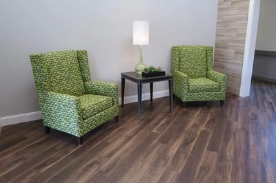 Interior seating area with patterned chairs and lamp