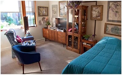 Cozy resident room with a bed and living area