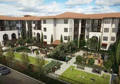 Aerial view of senior apartments with outdoor spaces and residents
