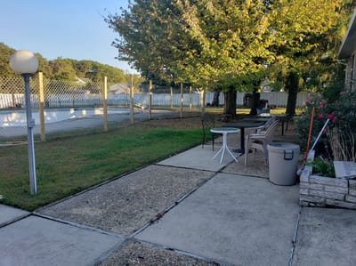 Outdoor patio area with seating and trees