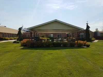Outdoor patio with seating area and landscaped garden