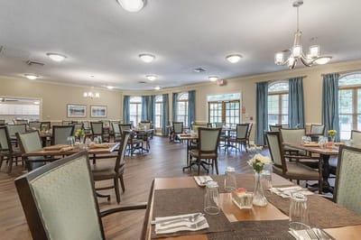 Dining room setup with tables and chairs