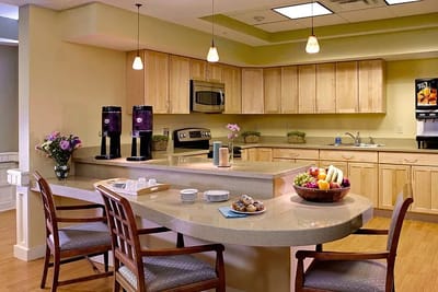 Bright dining area with fruit and snacks