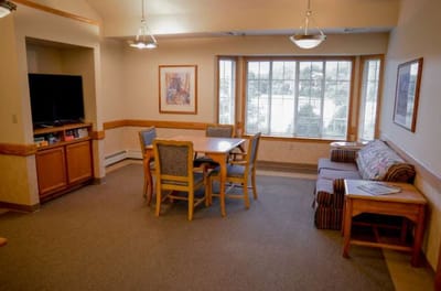 Interior common area with seating and dining table