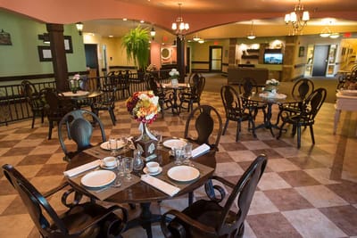 Dining room with tables and floral centerpiece