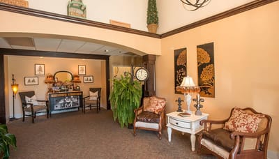 Interior seating area with decorative furniture and plants