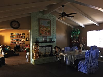 Dining area with residents in a cozy interior space