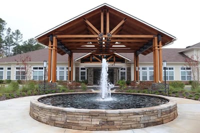 Exterior view of Oaks at Ashton Hills entrance with fountain