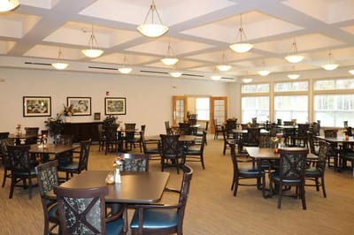 Bright dining room with tables and chairs arranged